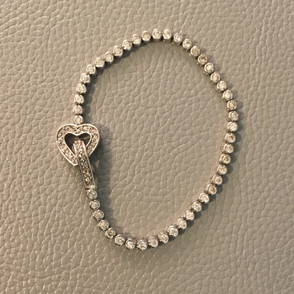 Silver tennis bracelet with heart clasp